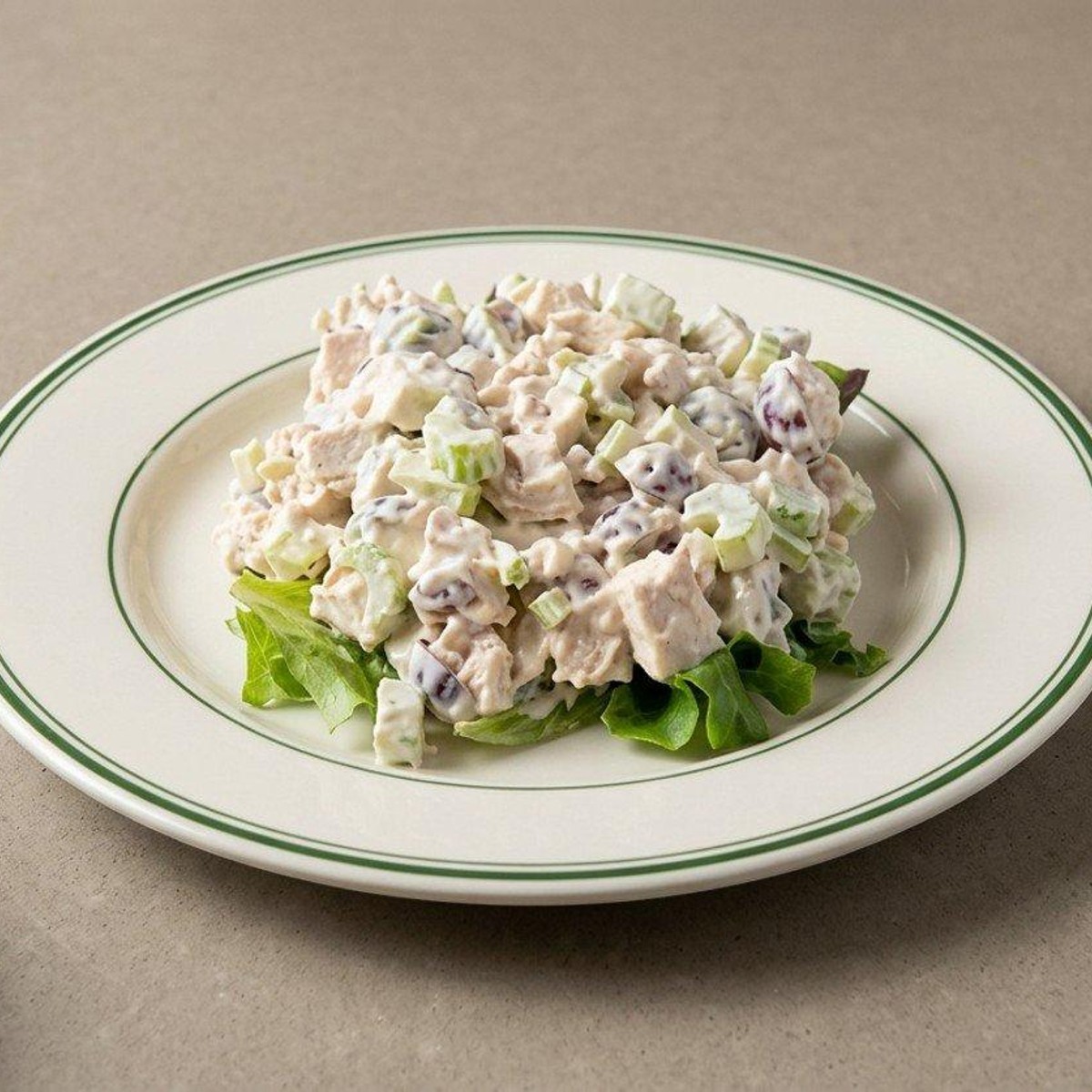 Chicken salad plate on a bed of greens