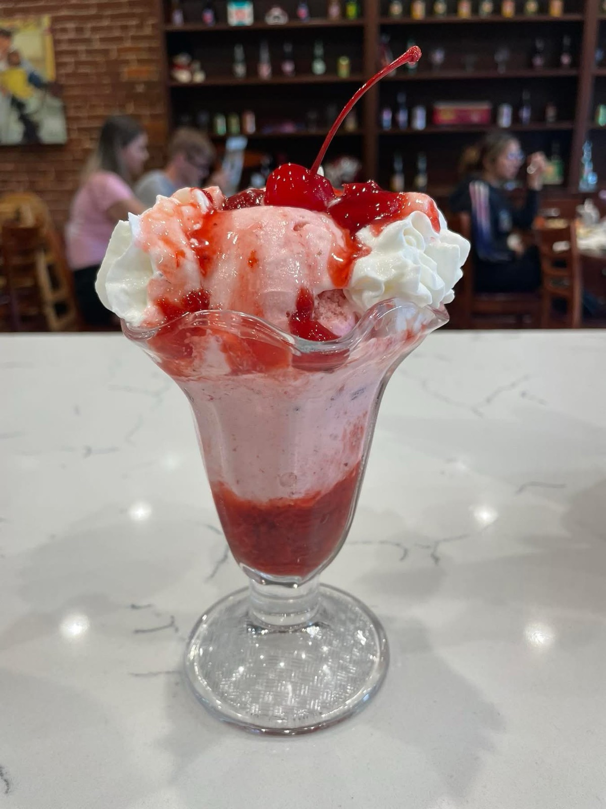 Sun-Drop float with whipped cream and cherry