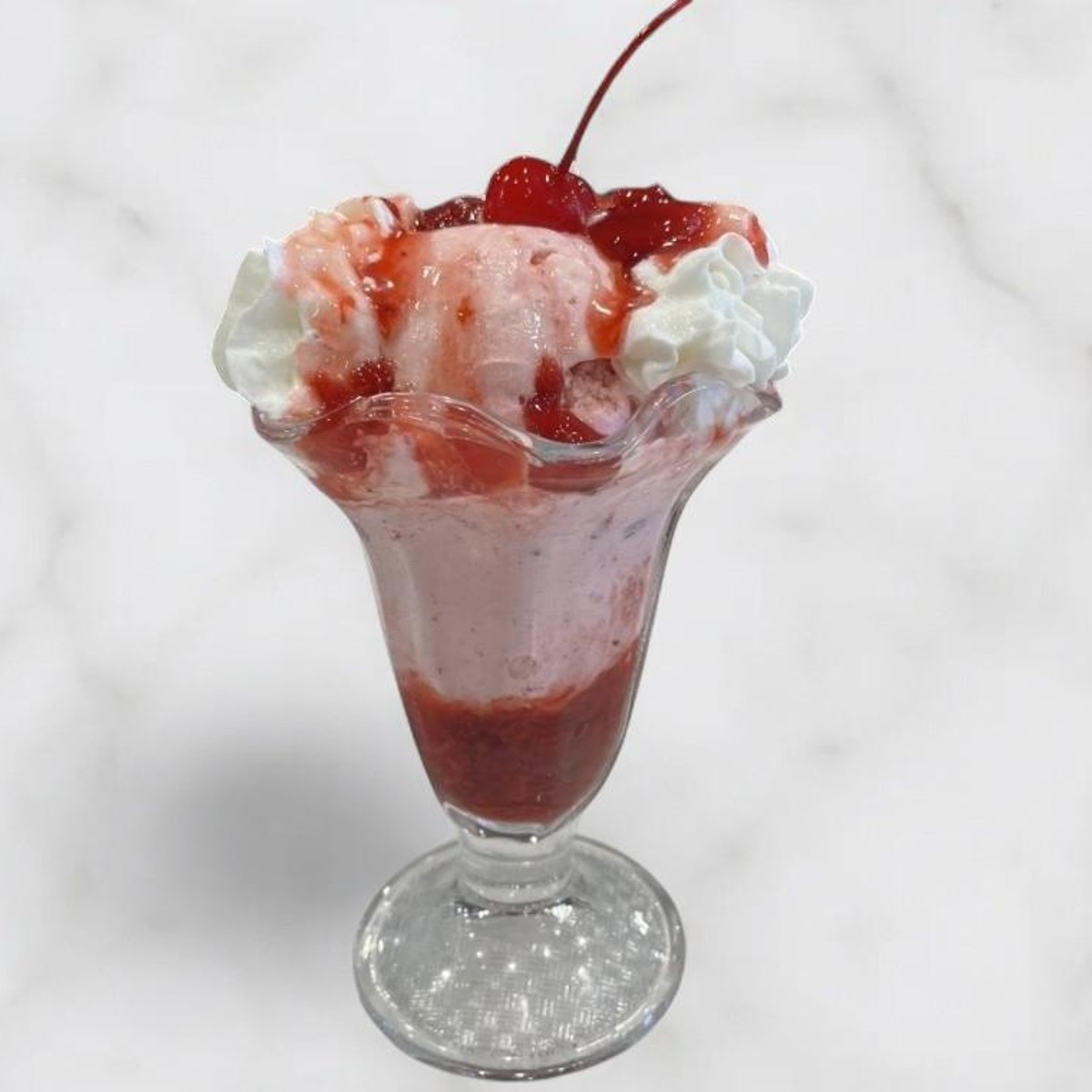 Ice cream sundae with whipped cream and cherry