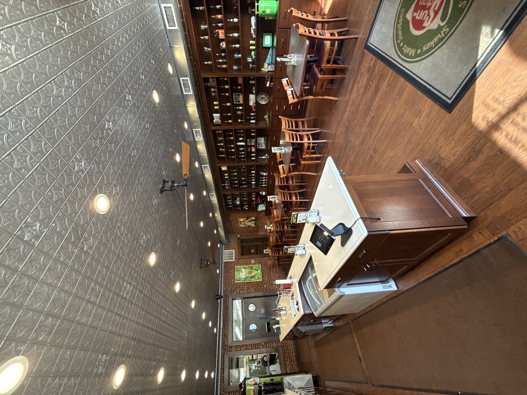 Sundrop Shoppe dining room with counter seating and vintage shelves