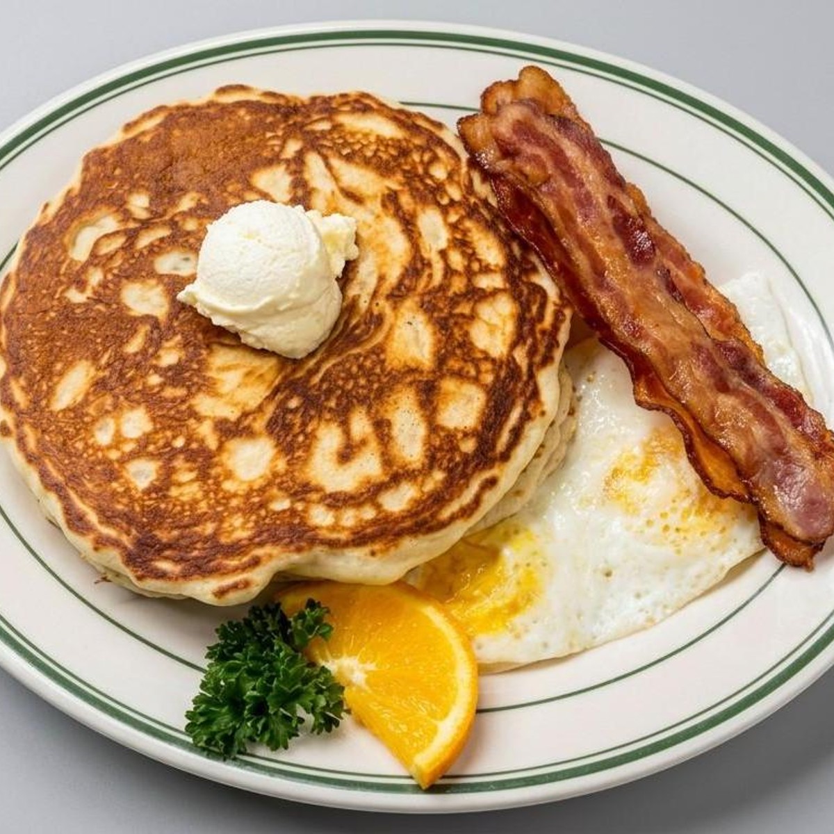 Pancake breakfast with eggs and sausage