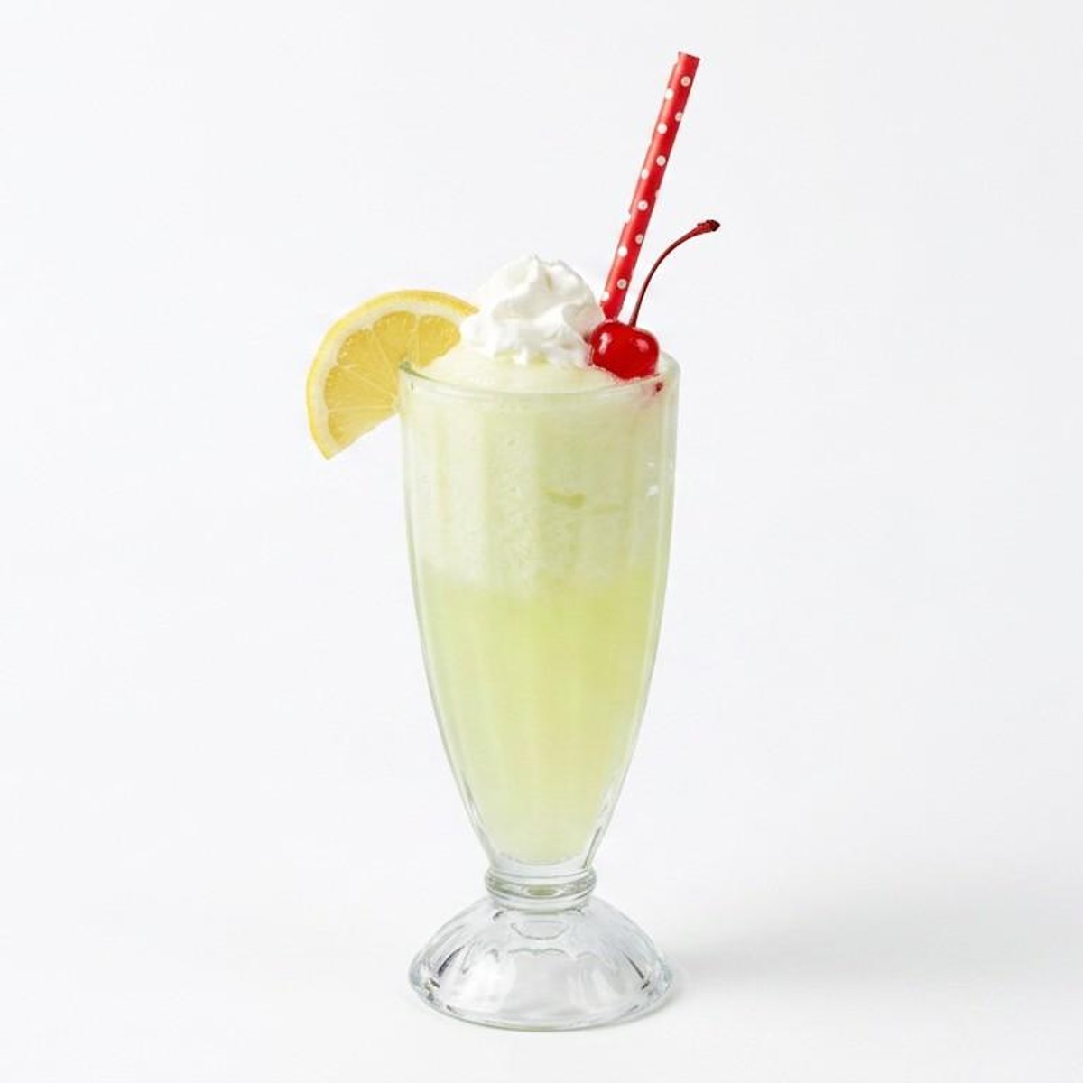 Sun-Drop float with whipped cream and cherry