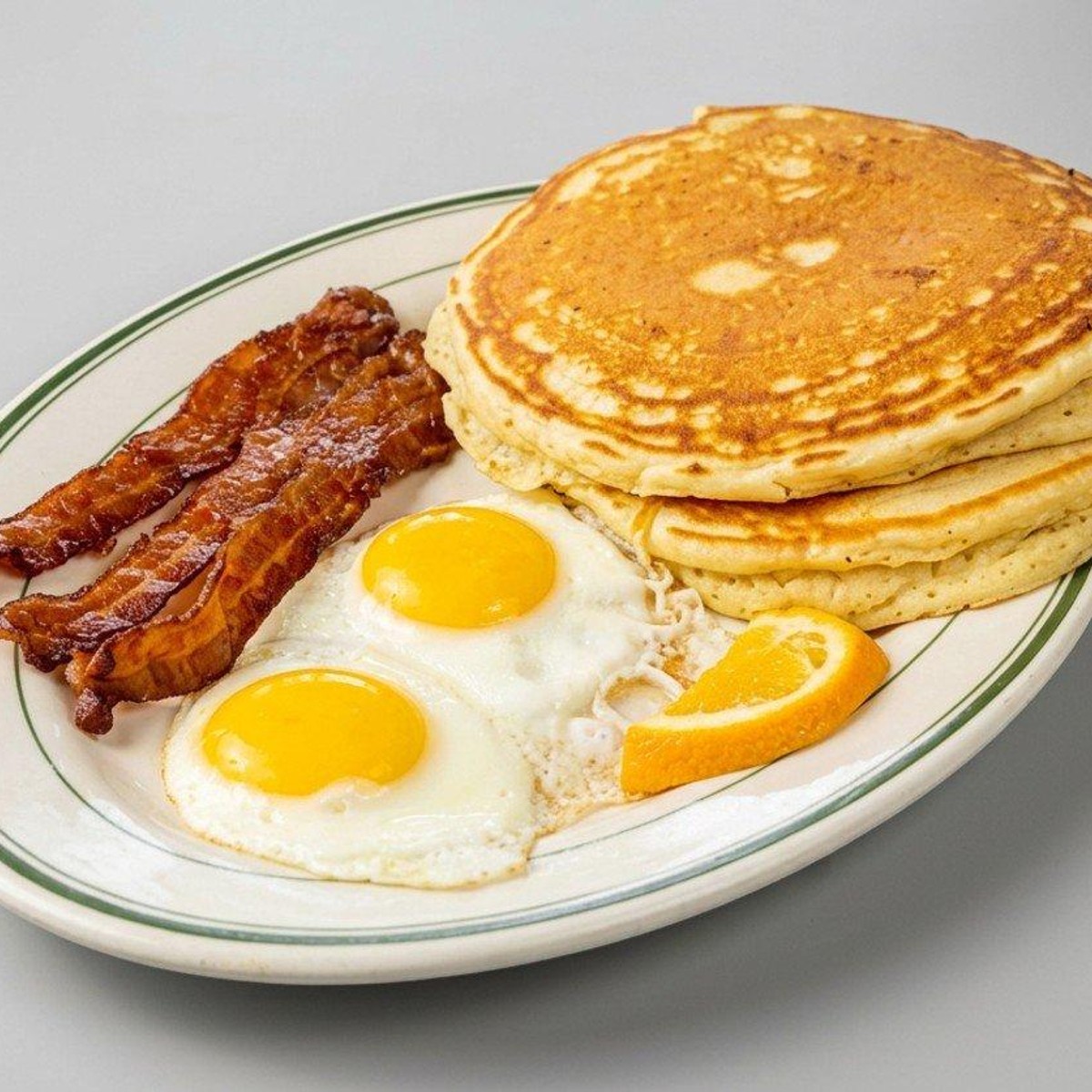 T-Town breakfast plate with pancakes, eggs and breakfast meat